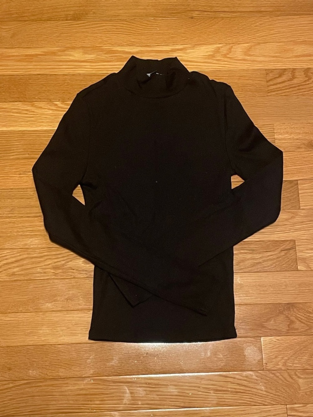Tight black turtleneck